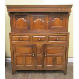 An 18th century oak Dudharn/court cupboard of good colour, the lower section enclosed by two