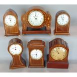 Five miniature mahogany and boxwood inlaid quartz clocks by Knight & Gibbins, together with one