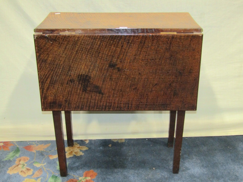 A small antique Countrymade oak single dropleaf table, raised on square tapered legs