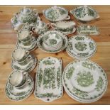 A collection of Masons Fruit Basket pattern wares in a green colourway, comprising a pair of tureens