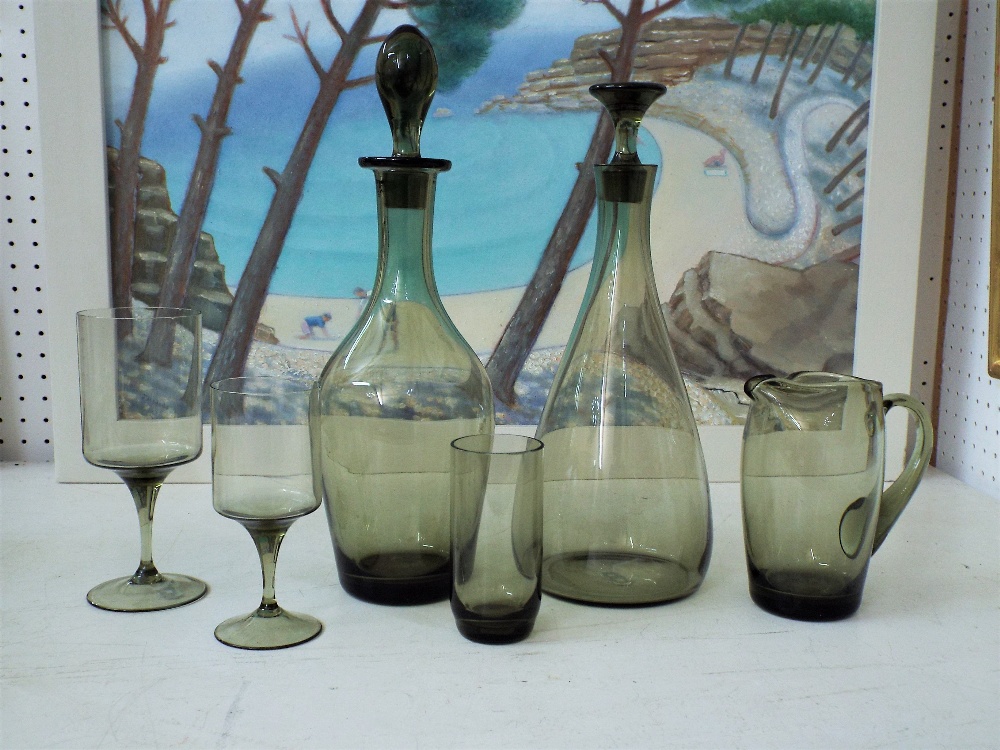 A collection of Holmegaard type smoked glassware comprising three decanters, a jug and nine - Image 2 of 2