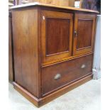 A low Victorian mahogany side cupboard enclosed by a pair of rectangular panel doors over a long