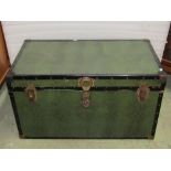 A modern pine blanket box with hinged lid, together with a travelling trunk with simulated green