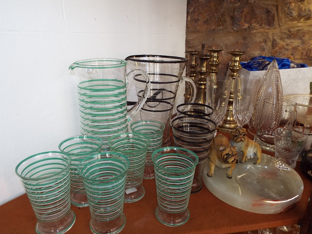 A collection of glassware including art deco lemonade set with green and white banded detail,