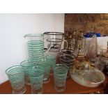 A collection of glassware including art deco lemonade set with green and white banded detail,
