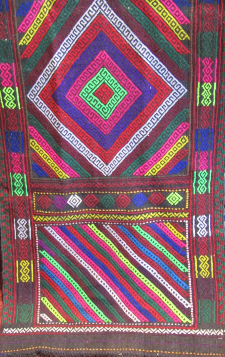 Gazak rug with geometric decoration upon a navy blue ground, 120 x 115cm