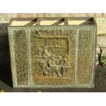 A wooden brass overlaid/clad three divisional umbrella/stickstand with embossed tavern scene and