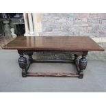An old English refectory table, the Elizabethan style base with carved baluster supports, united