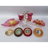 A collection of art glass with pink and yellow tint comprising four various dishes and vases,
