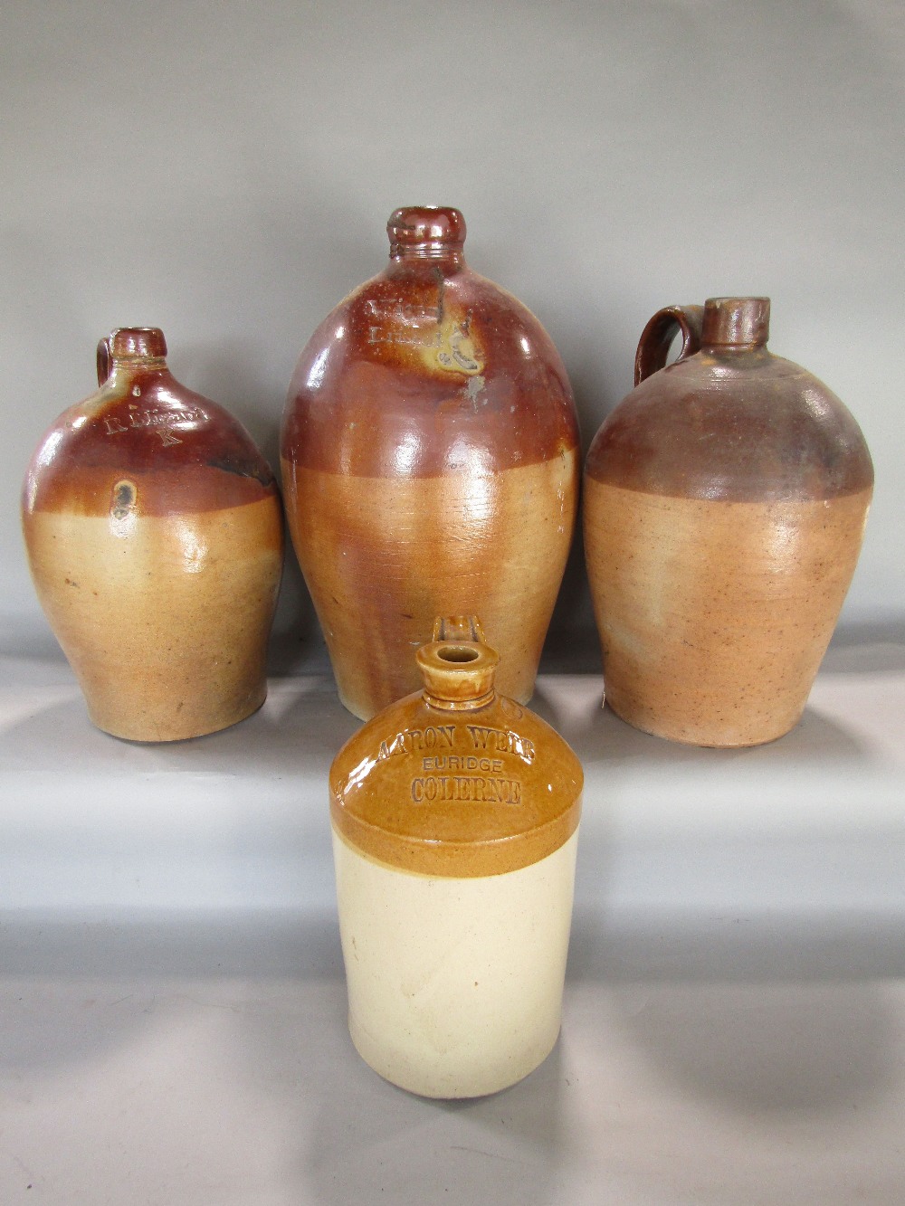 Four early 19th century flagons - R Blizard K - Wigan, Bristol, a further anonymous jar and a