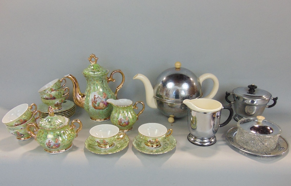 A continental porcelain coffee service in a green and gilt colourway, together with a further