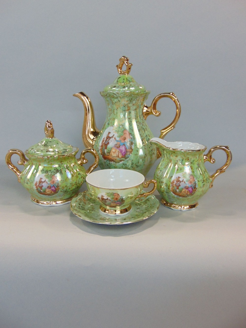 A continental porcelain coffee service in a green and gilt colourway, together with a further - Image 2 of 3