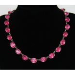 Georgian silver pink paste riviere necklace, composed of twenty four foiled oval collets, 39.5cm