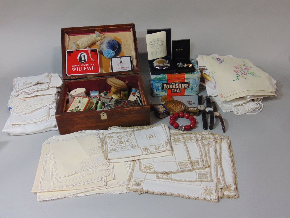 Wooden box containing sewing haberdashery, together with a collection of natural linen table mats