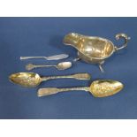 A pair of George III fiddle pattern berry spoons, with faceted wrythen fluted handles, maker TD,