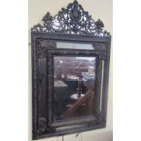 19th century continental wall mirror, with embossed brass framework incorporating six mirror plates,