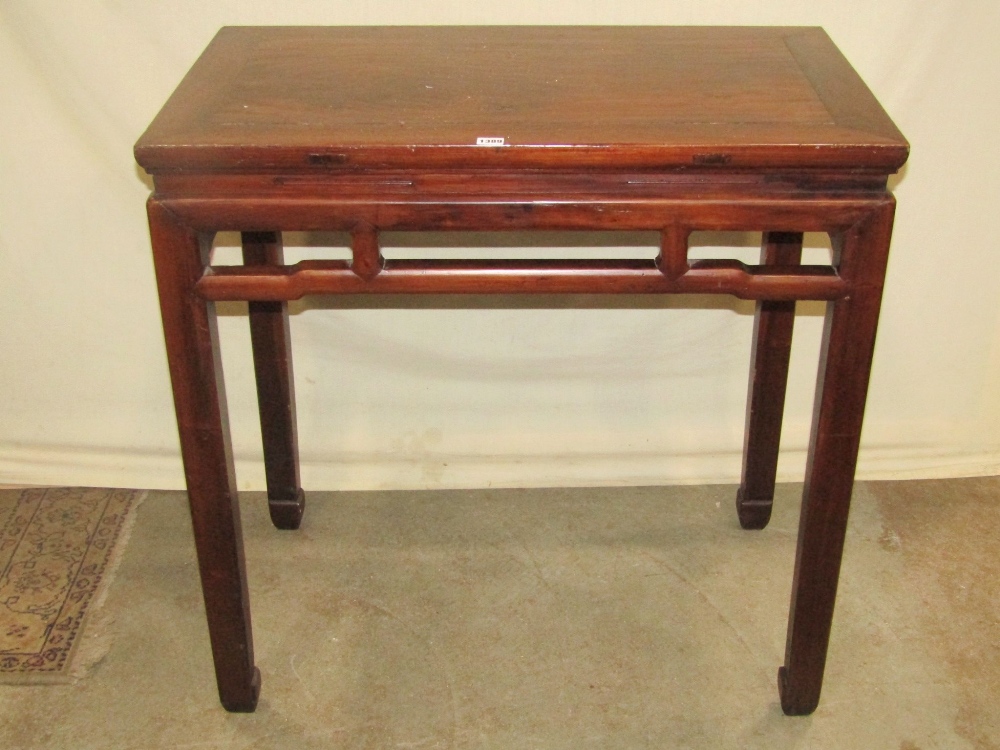 A Chinese stained soft wood high side/altar table of rectangular form raised on square cut and