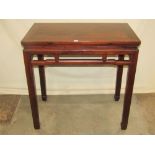 A Chinese stained soft wood high side/altar table of rectangular form raised on square cut and