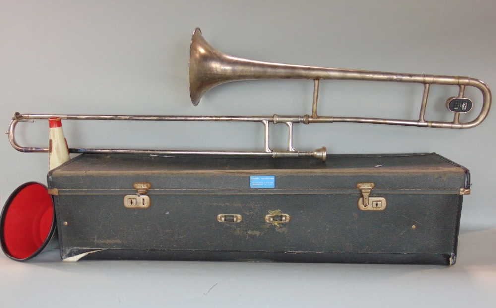 A Boosey & Hawkes silver plated trombone - The Regent B6 tenor with mute, sheet music clip, etc,