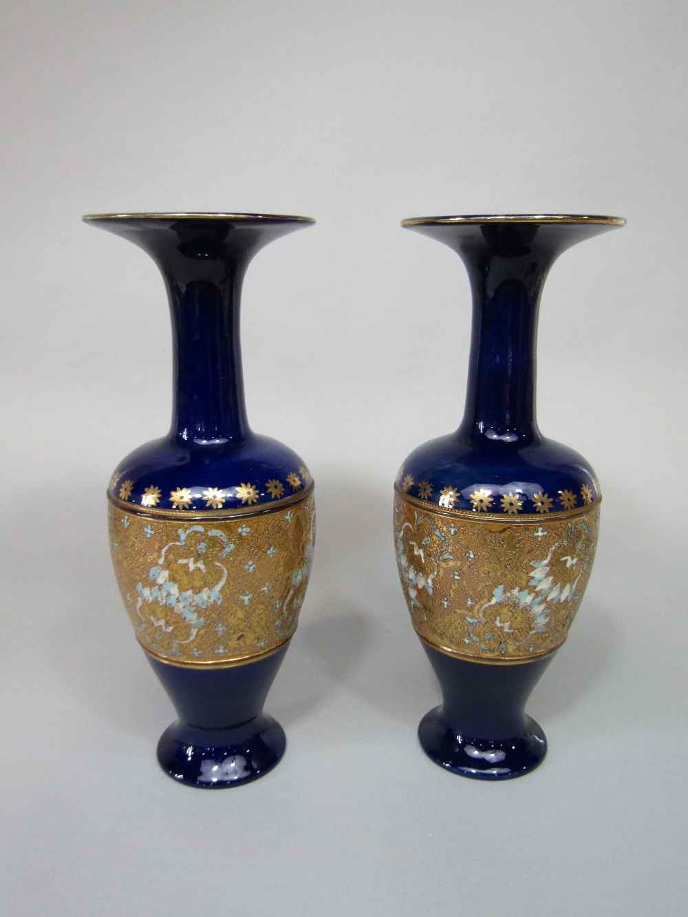 A pair of blue ground Royal Doulton Slaters patent vases, with impressed mark to base, 35cm approx