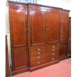 A good quality 19th century mahogany breakfront sectional wardrobe, the central elevation enclosed