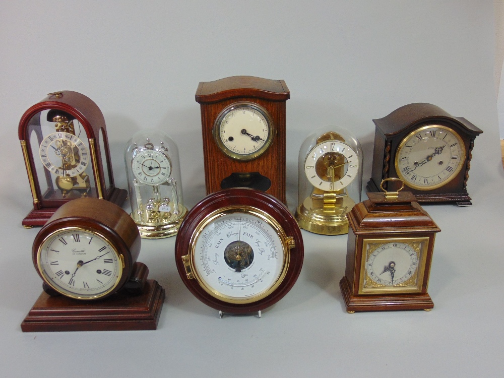 A collection of various mantel clocks to include torsion examples, Commeti, Smiths and others (8)