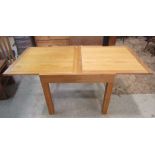 A good quality contemporary light oak Venice range draw leaf dining table of rectangular form raised