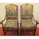 A pair of late 17th/early 18th century walnut open armchairs with scrolled arm, turned supports