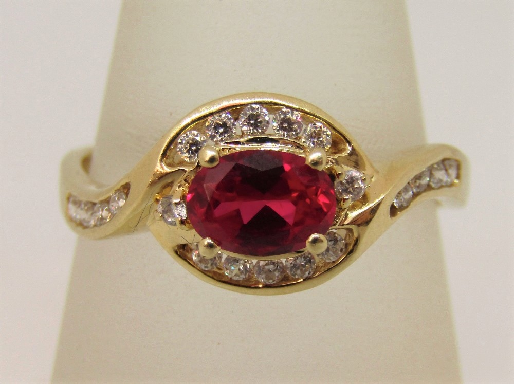 14ct ruby and cubic zirconia crossover dress ring, size T, 3.6g