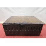 An 18th century oak bible box, with rising lid, the front elevation with geometric carved detail,