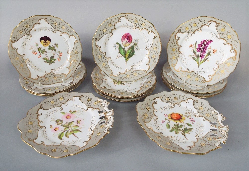 A collection of 19th century dessert wares with painted botanical sprays within a pale grey and gilt