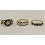 Three 9ct dress rings set with cubic zirconia and blue spinels, sizes M - O, 8.8g total (3)