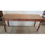 A stained pine kitchen table of rectangular form raised on four turned legs (AF) 172 cm long x 55 cm