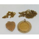 Sovereign dated 1888 in an openwork pendant mount, together with an engine turned 9ct heart shaped