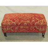 A good quality upholstered stool of rectangular form, raised on square taper legs