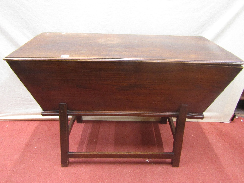 A Georgian elm dough bin on usual construction on an open framework, 115cm long