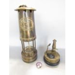 A miners lamp by E Thomas & Williams, Cambrian number 40353, together with a small commemorative