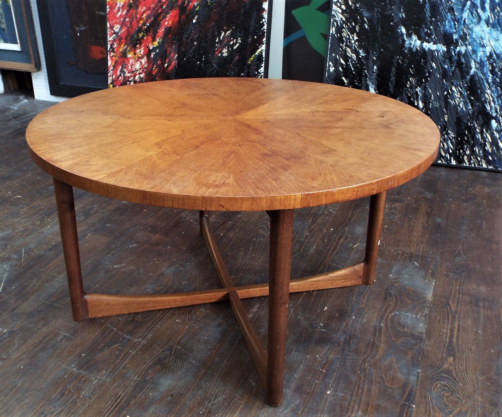 A. H. McIntosh of Kirkcaldy - Teak 'Sunburst' coffee table, the circular top upon tapered legs