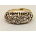 Impressive Victorian diamond ring set with sixteen graduated stones in total, largest pair of
