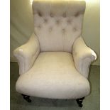 An Edwardian drawing room chair with later upholstered finish, the frame with scrolled back and arms