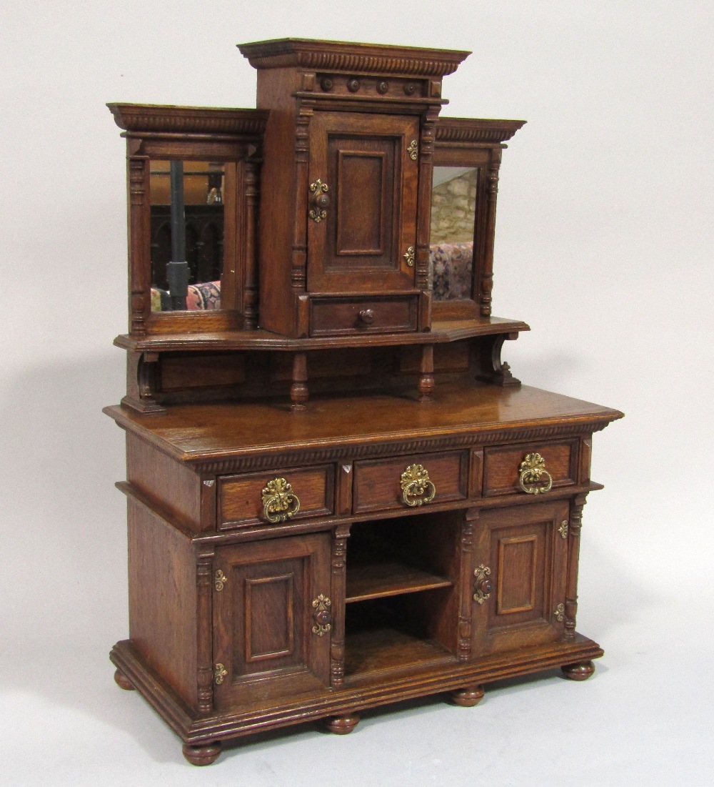 Late 19th century apprentice oak sideboard, the lower section enclosed by two doors and three