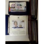 Two Royal Mail albums containing a large collection of mint stamp sets, a box containing further