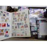 A box containing a large quantity of stamps on stock cards etc