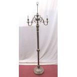 A brass floorstanding three branch lamp standard, raised on a turned column and disk base