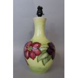 A substantial Moorcroft yellow ground table lamp base with purple and pink floral garland decoration