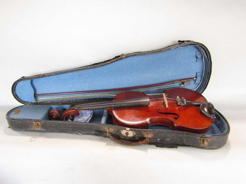 A violin case and a bow by Thiery of Paris, one piece back