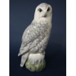 A large Royal Copenhagen model of a snowy owl with printed and painted mark to base no 1829, 39.