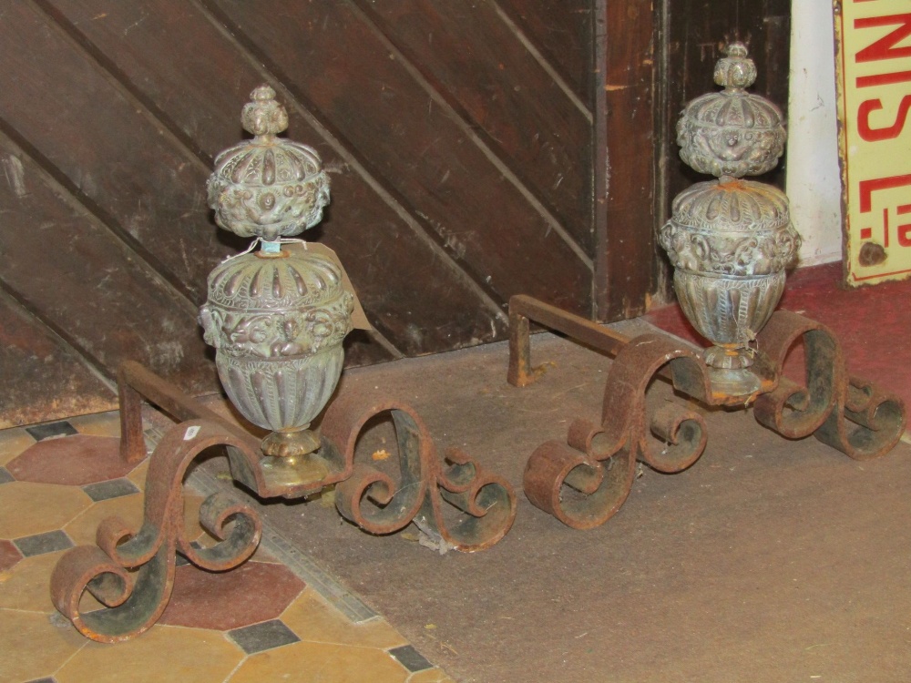 A pair of antique andirons with cast brass baluster shaped stems/finials with repeating mask and - Image 2 of 2