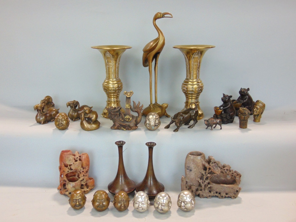 A collection of eastern wares including two bronzed figures of a pig and a rat, both with baskets,