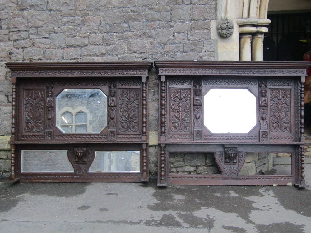 A pair of 19th century overmantels, the profusely carved oak frames with lions mask bosses, part